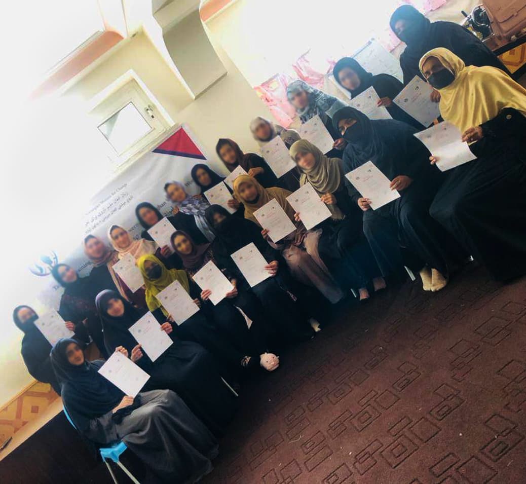 Participants gathered at a graduation ceremony after training in Kabul