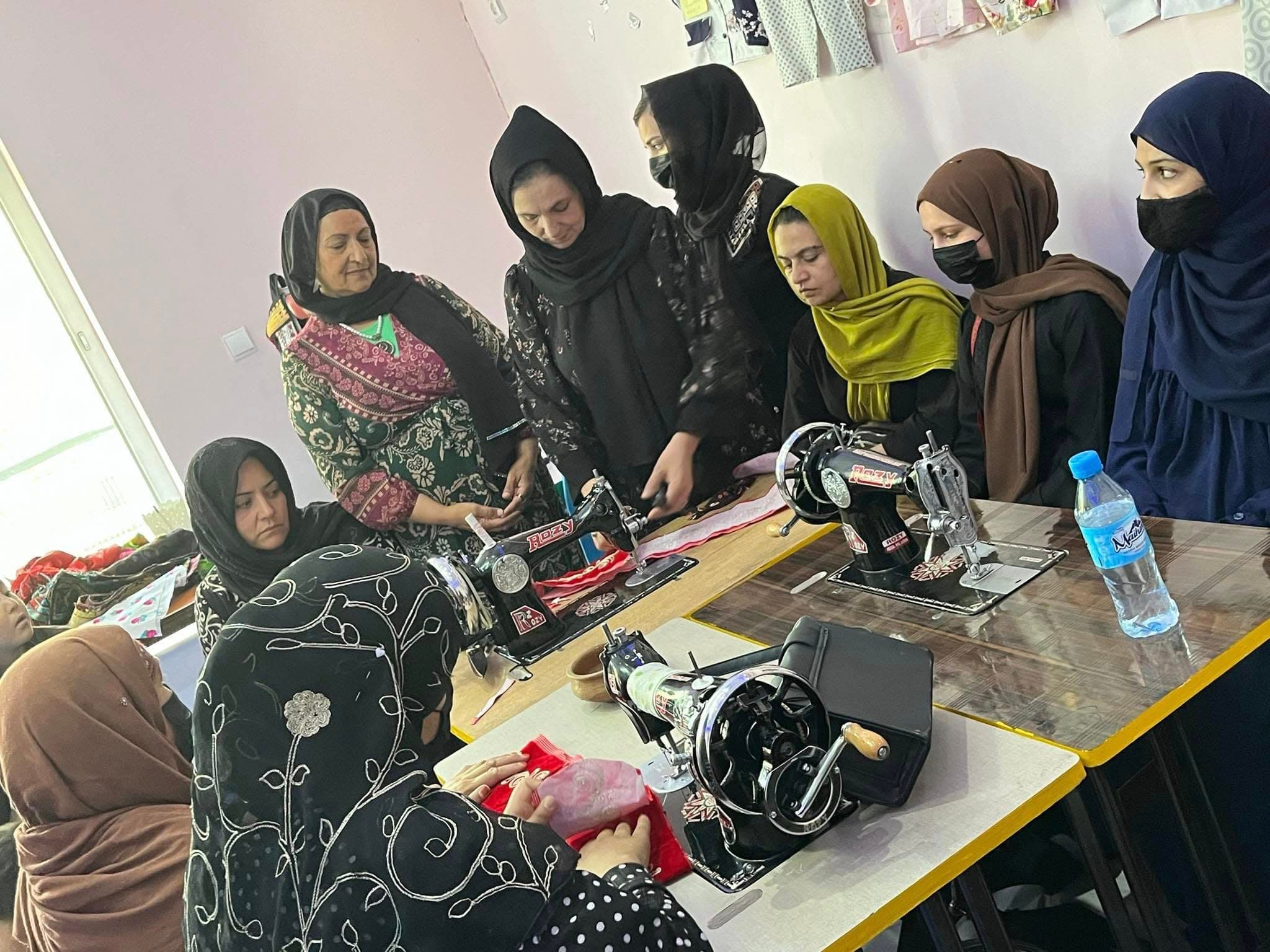 Participants using sewing machines during tailoring training at a centre in Kabul